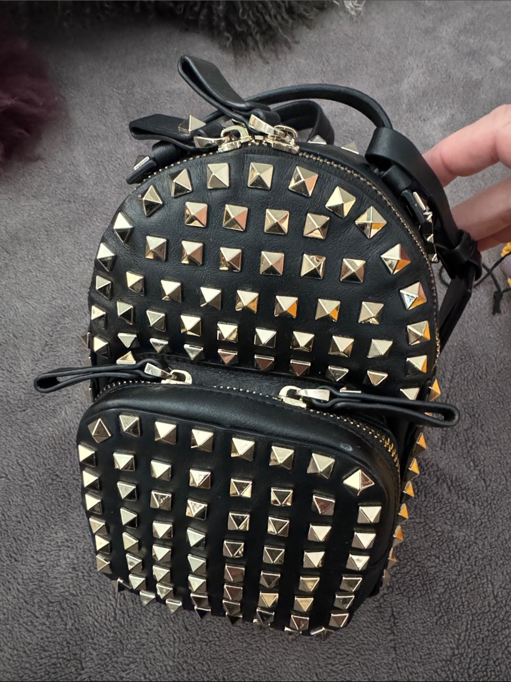 Valentino Garavani Black Leather Mini Backpack with Gold Pyramid Studs
